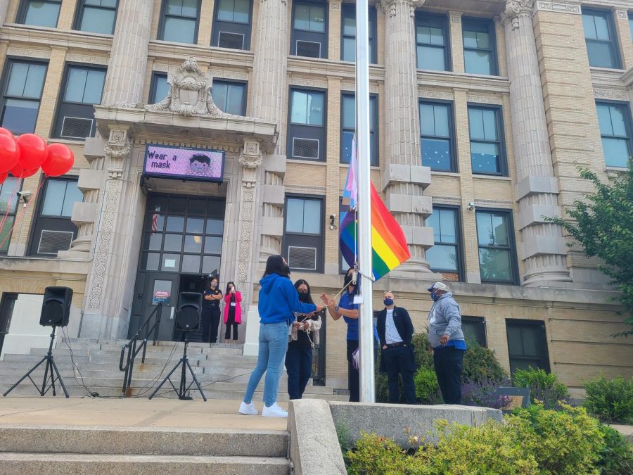 Madeline Urena begins to pull the flag rope.