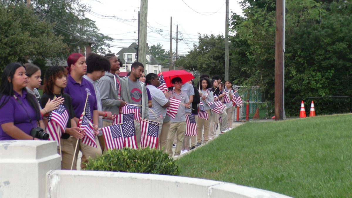 Passaic Prep seniors line up with American flags during the 9/11 Memorial ceremony. 