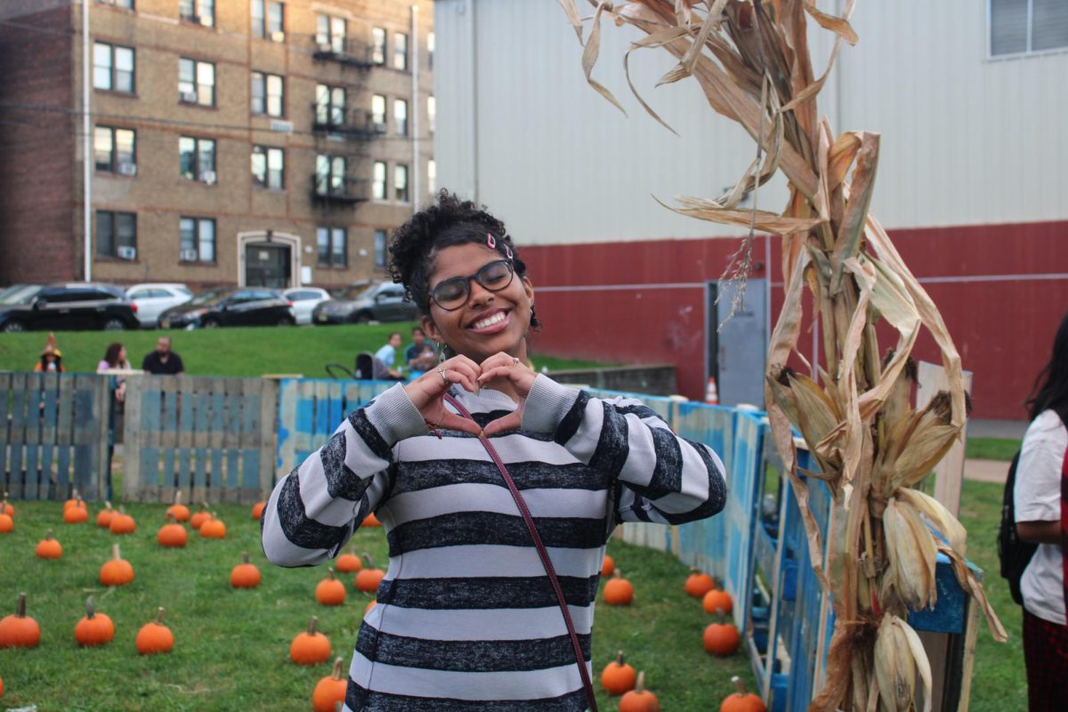 Student Annieris Ogando from PCTI being a helper at the Pumpkin Patch