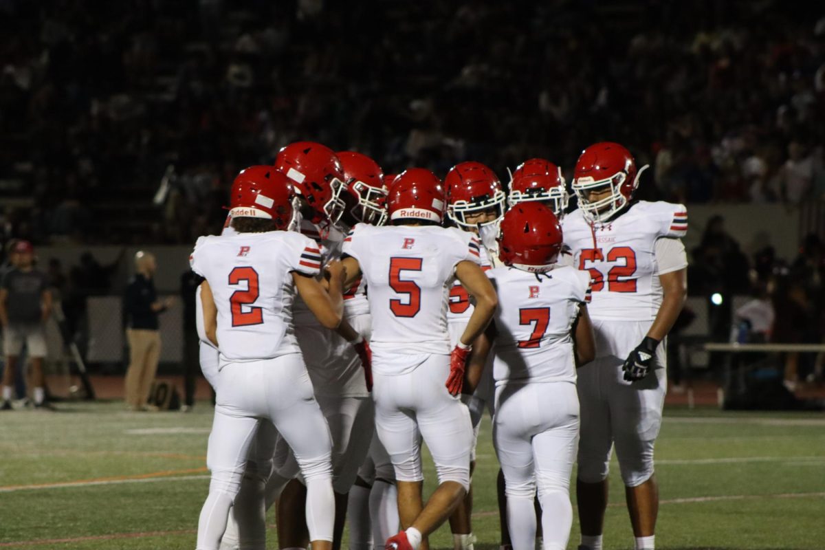 No. 2 Kendrick Fernandez, No. 5 Peter Rodriguez, No. 7 Jamari Miller, No. 52 Reyli Gonzalez in huddle